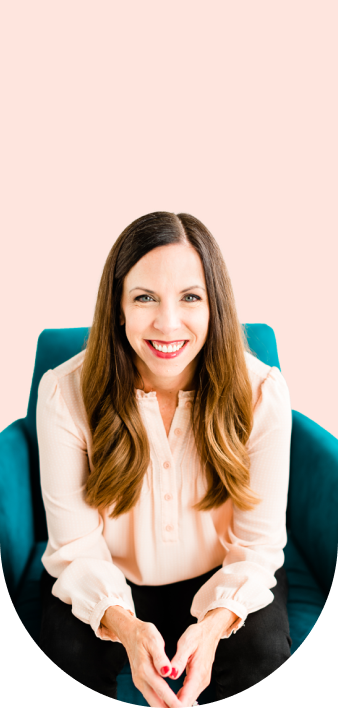 Bonney sitting on couch smiling with coral background